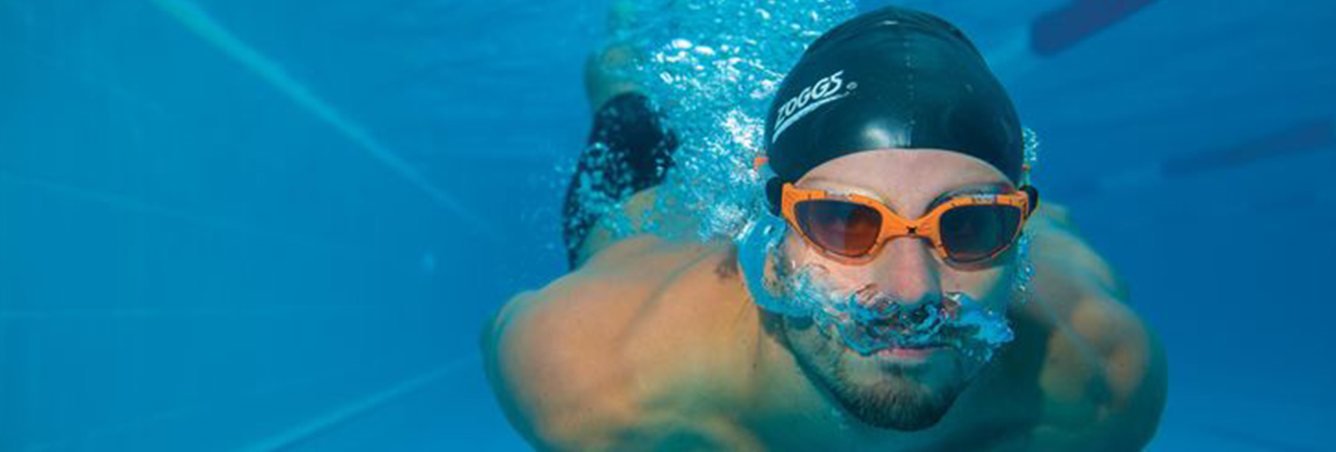 Athlete swimming underwater in the pool