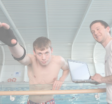 Athlete swimmer going through techniques with sports scientist