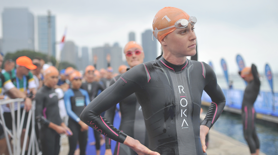 Swimmer observing other swimmers in the sea after a swimming race