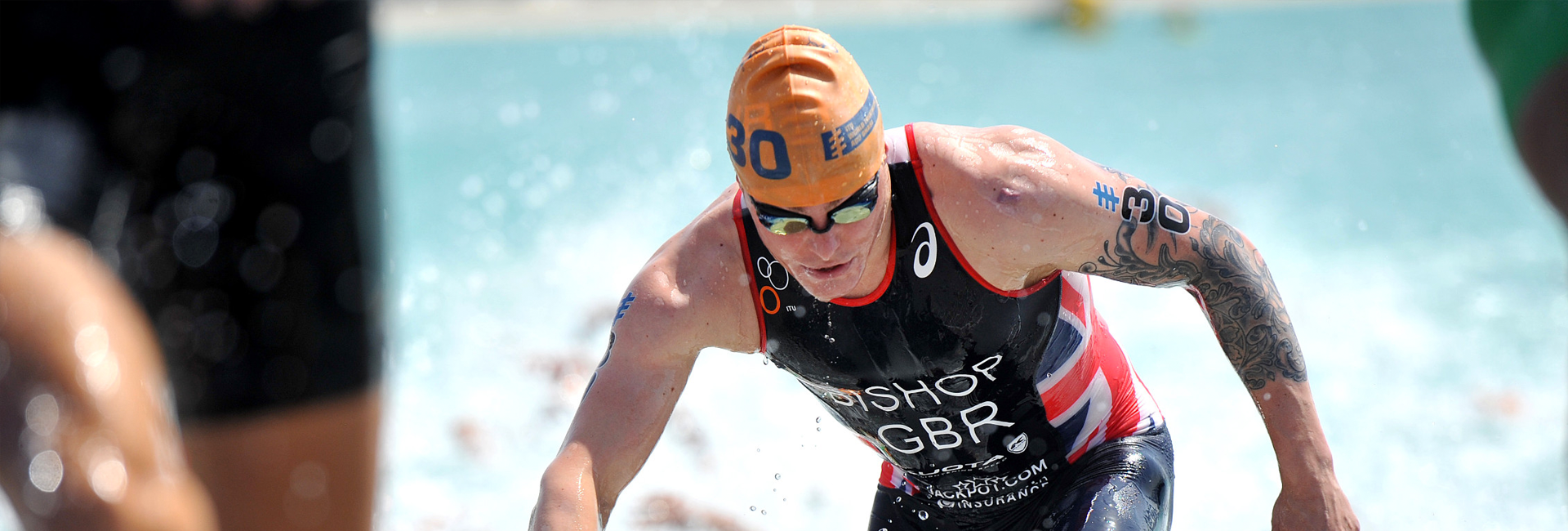 Coach providing support for young triathlete