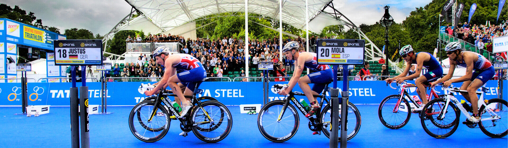 Group of Athlete Cyclists preparing to start a Triathlon Race