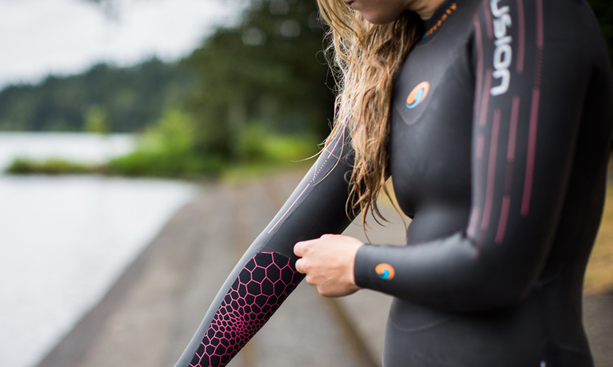 Female swimmer looking outward to the sea to begin a triathlon race 