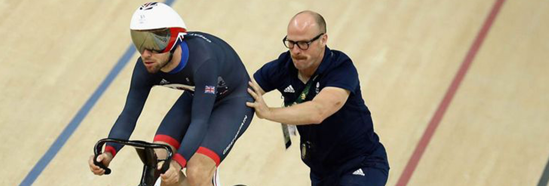 Athlete Cyclist receiving guidance from coach