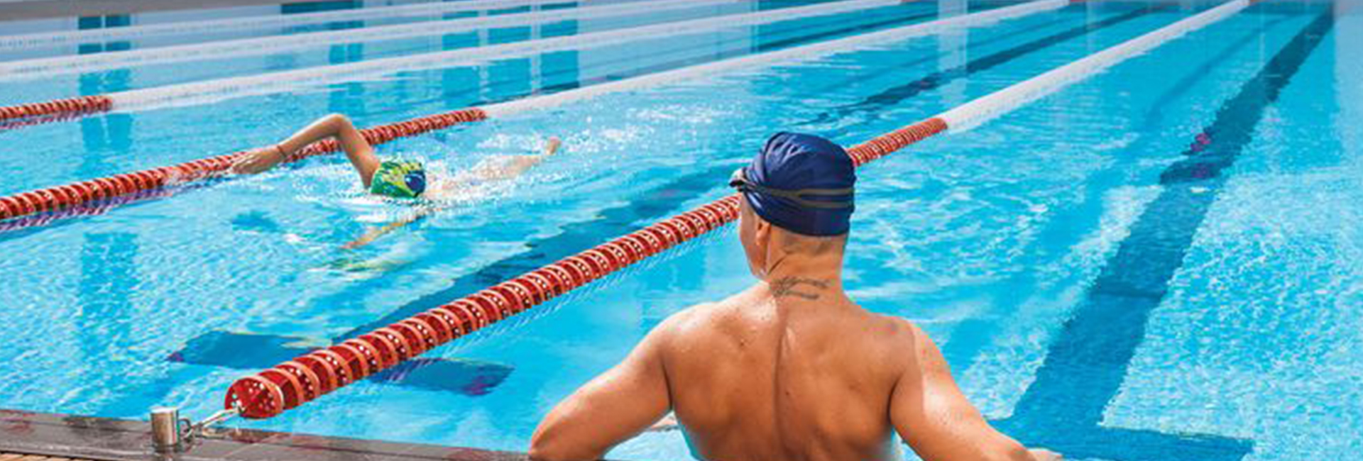 Swimmer observing other competitors in the pool