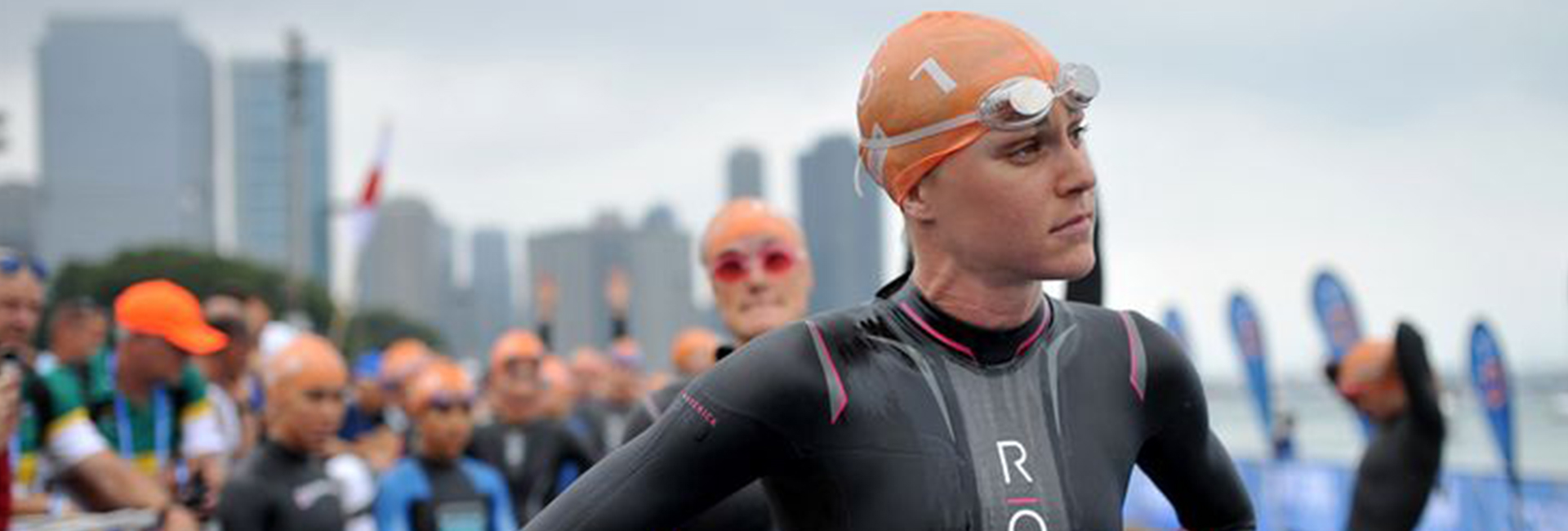 Athlete swimmers gathering in a group after a triathlon race to receive results