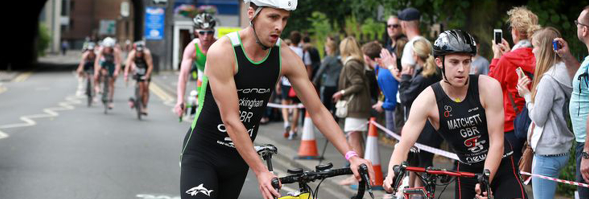 Two cyclists performing in triathlon marathon