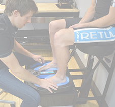 Athlete runner foot examination by sport scientist