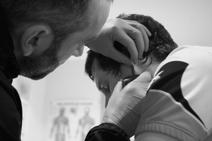 Sports scientist giving athlete a performance assessment