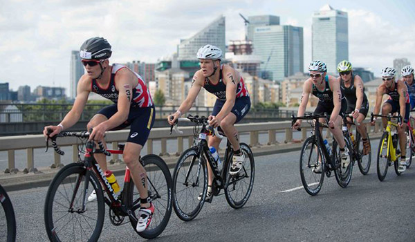 Group of cyclists cycling as part of a race