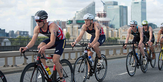 Group of athlete cyclists taking part in a triathlon race