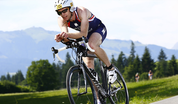 Athlete cyclist cycling on a path