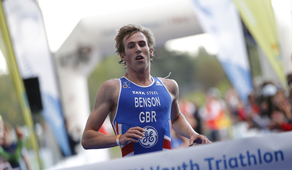 Athlete runner finishing a triathlon in first place