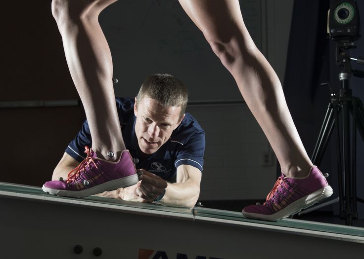 Customer receiving foot examination from physiotherapist 